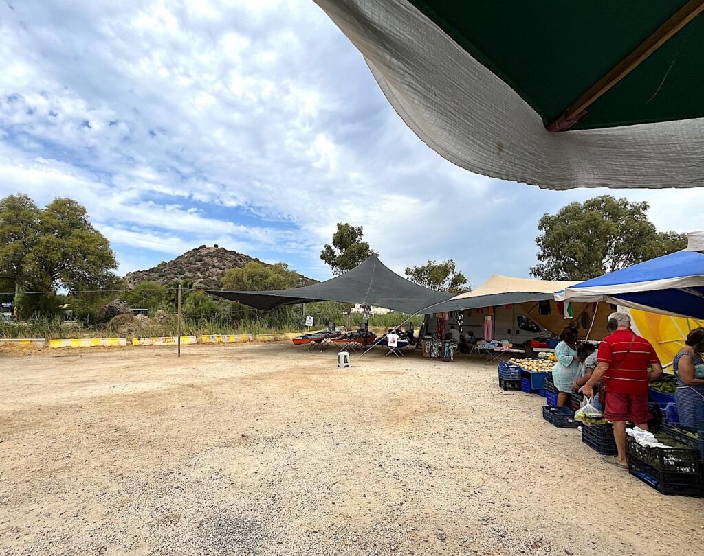 Ildır Market with ancient Erythrai Acropolis in the Background 